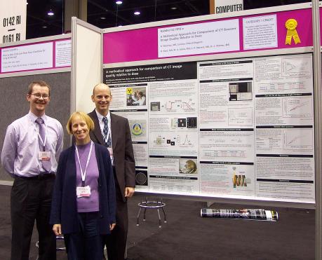Figure 3: ImPACT members with one of their posters at RSNA 2003